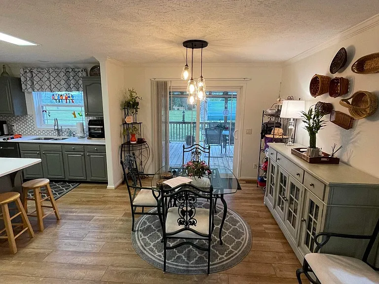 Eat in kitchen. Sliding back door to covered back porch, which leads to a fenced in 1 acre backyard.