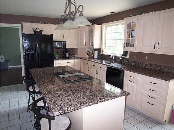 The chef in you will love the amount of cabinet space and expansive granite counter tops.  Guests can sit at the island while yo