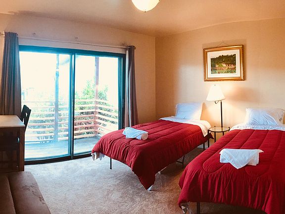Bedroom 2 with balcony outside the sliding door