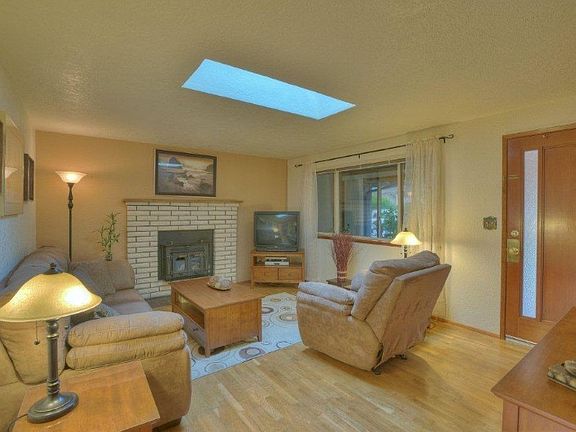 Classic hardwood floors throughout living, hallways & bedrooms. Wood-wrapped new windows throughout.