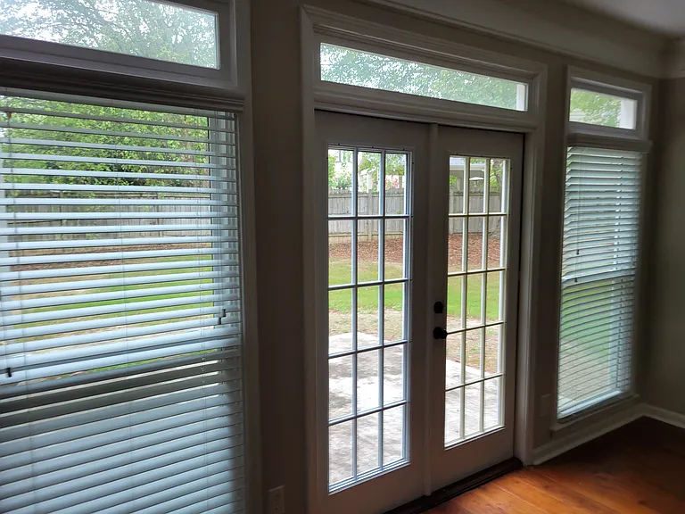 These are the doors from what I referred to as the family room or where couches would go to entertain. For reference in the picture were it bigger you would see a fireplace to the immediate right.