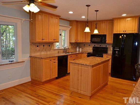 Renovated kitchen with beautiful cabinets, granite countertops and space savers in the cabinets with