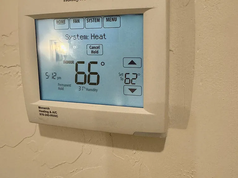 Smart Thermostat can be controlled through WiFi. Separate controls for upstairs and downstairs.