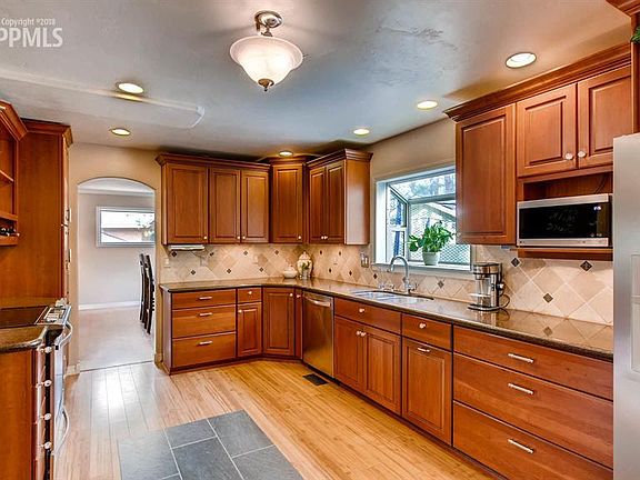 Remodeled kitchen with Omega Cabinets!  Granite, Stainless, Custom floors!