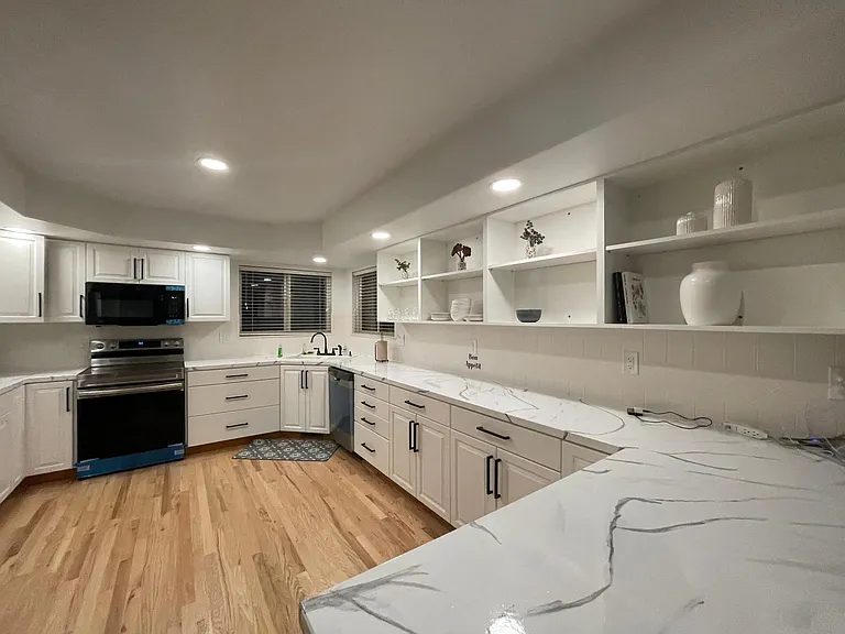 New stainless steel appliances in kitchen.
