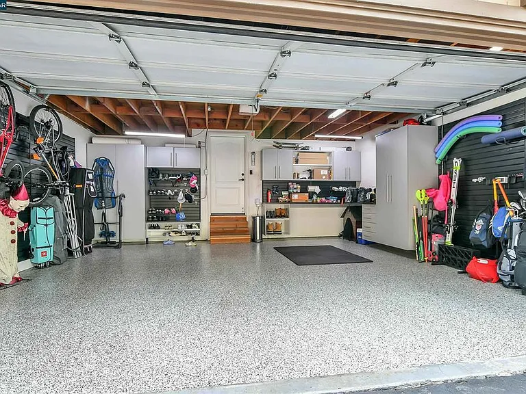 2 Car Garage with Custom Built Shelving and Storage