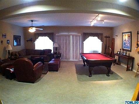 Living room and dining room. (Or pool room!)