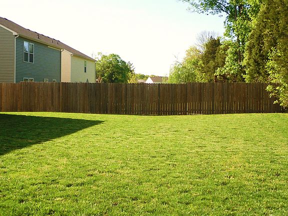 Large back yard fence on 3 sides