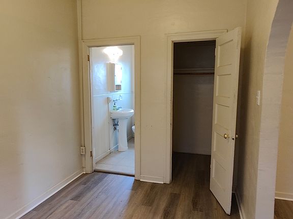 Bedroom has new plank flooring and a walk-in closet. The bathroom is adjoining.