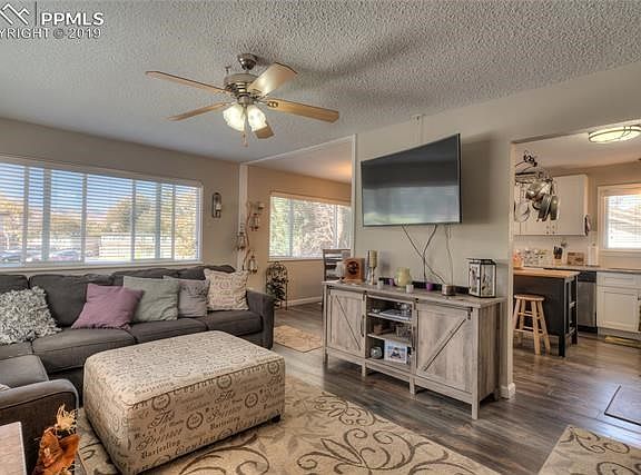 Main level open concept floor plan! Bright, tons of natural light, great views. Engineered laminate wood flooring throughout the living room, dining area and kitchen.