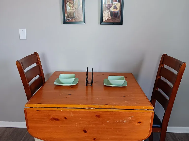 Cozy eat-in area in kitchen with deck access.