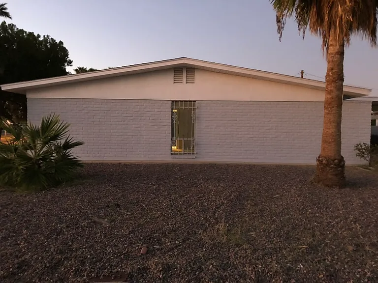 Sidewalk view of 2406 E Alpine Ave