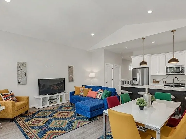 Living Room (Angle 1): Vibrant open-concept living and dining