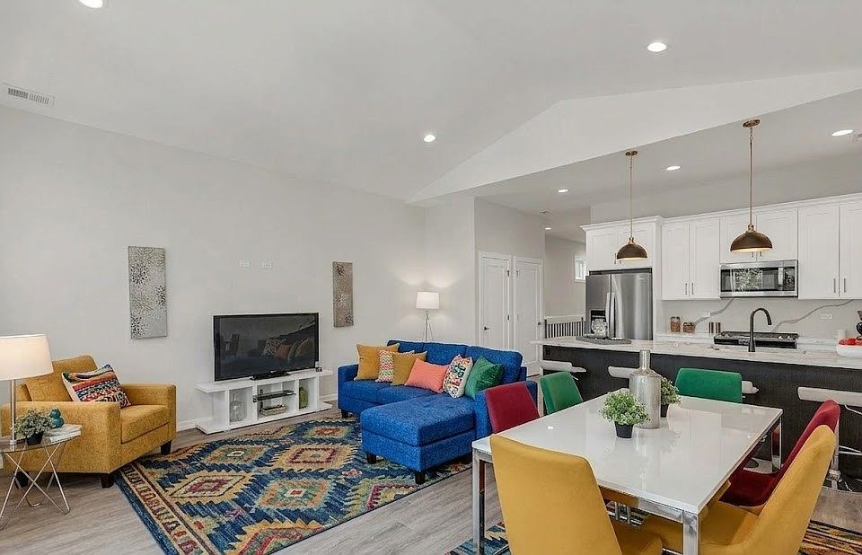 Living Room (Angle 1): Vibrant open-concept living and dining