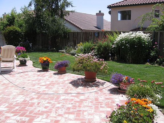 Custom brick patio and professional landscaping