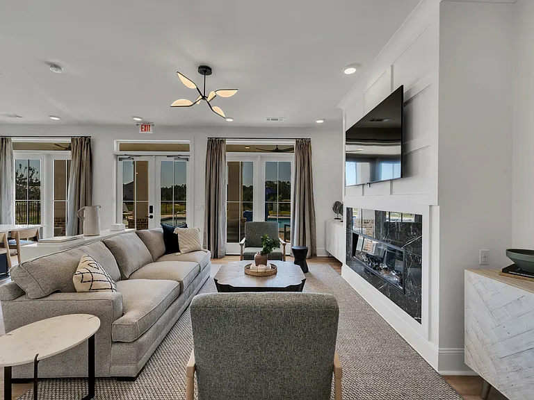 Gather with neighbors in our cozy lounge with fireplace and flat-screen television