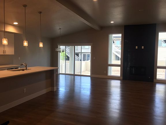 Open Kitchen + Formal Dining + Living Room w/Fire Place