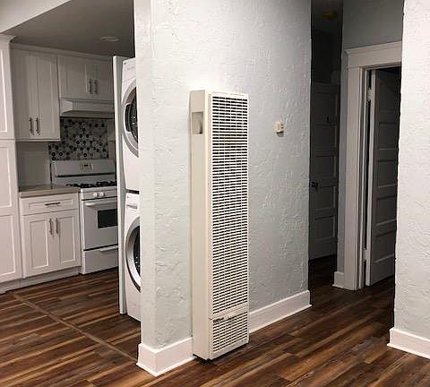 Entry view: living room and view of kitchen and hallway to bedroom and bathroom