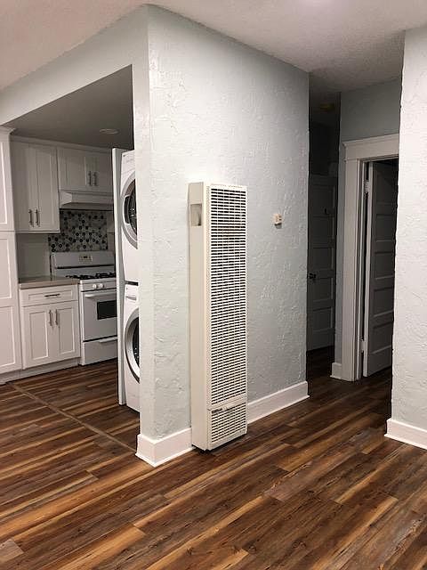 Entry view: living room and view of kitchen and hallway to bedroom and bathroom