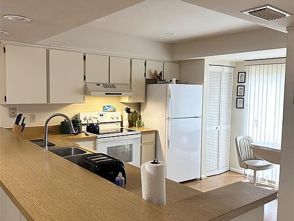 Kitchen with a washer, dryer and dishwasher