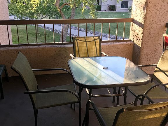Balcony off living room and kitchen with walkway in view