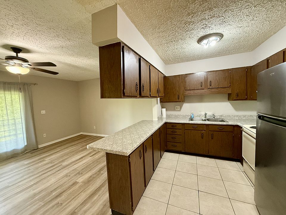 Open living area and kitchen with breakfast bar