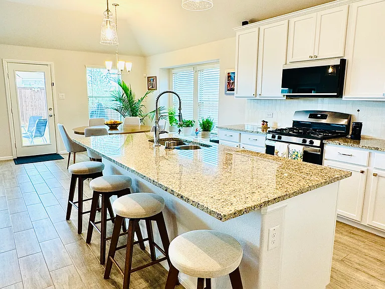 Bright and expansive open-concept design with a beautiful gourmet kitchen, large granite island, and modern finishes_ideal for hosting guests and everyday comfort.