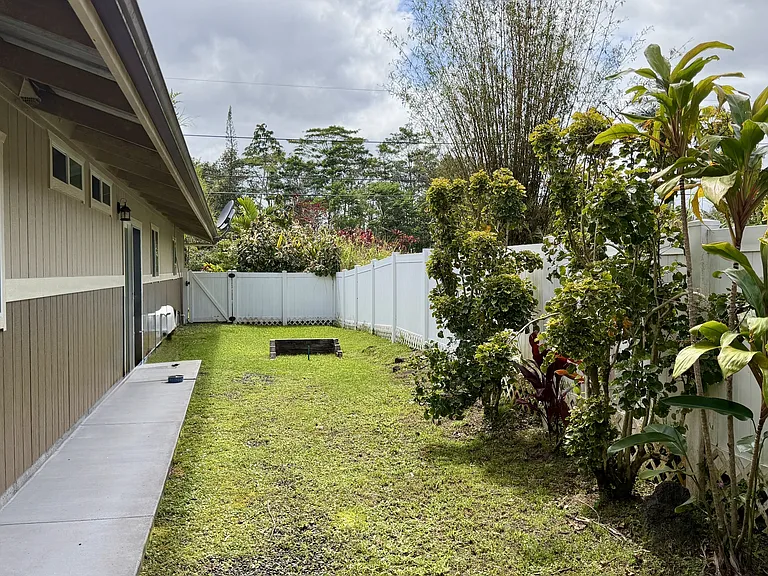 Slider from kitchen dining leads to sidewalk and back patio