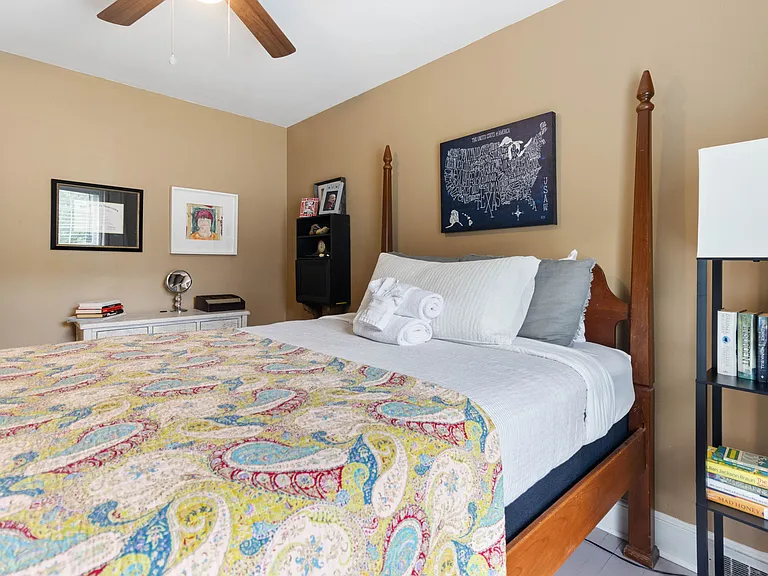 Larson's Room at Hunsucker's Place features a plush memory foam bed, warm decor, and natural light. Conveniently located near Downtown Greensboro and Cone Health Hospital, this cozy space provides comfort and charm in a beautifully central home.