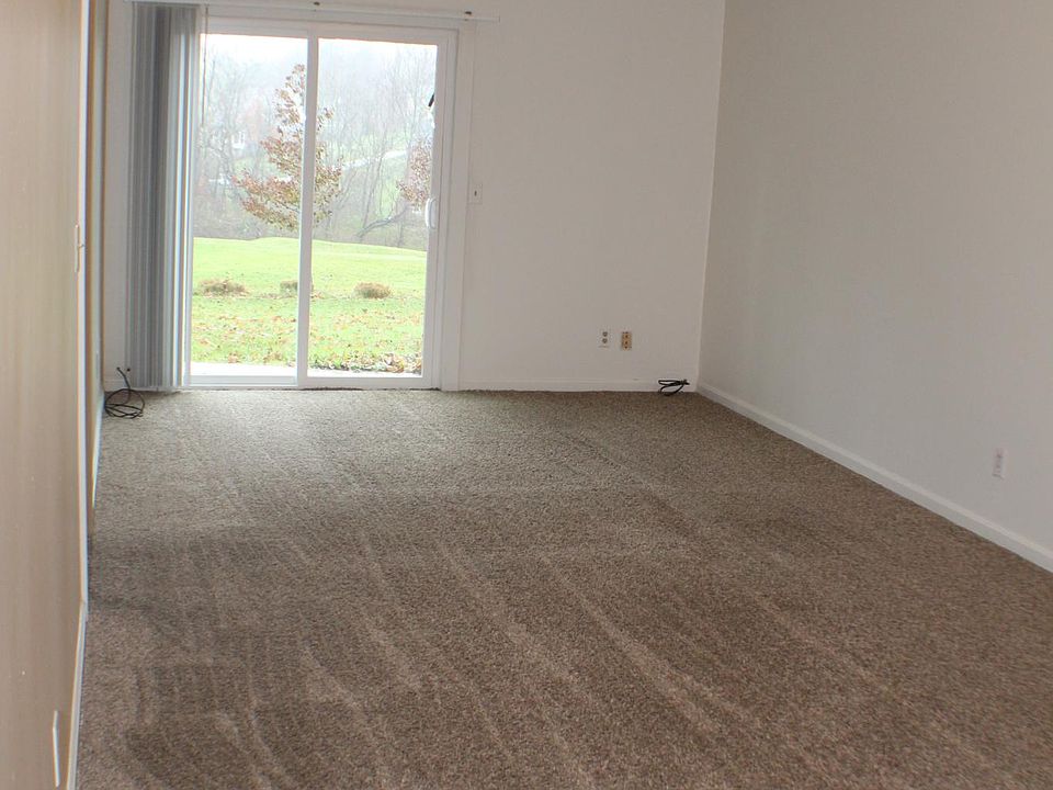 Great room with walkout to private patio overlooking a golf course.