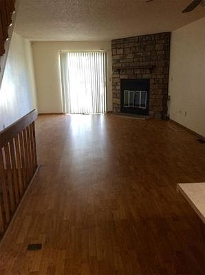 Large Living Room with Wood Burning Fireplace and Dining Area.