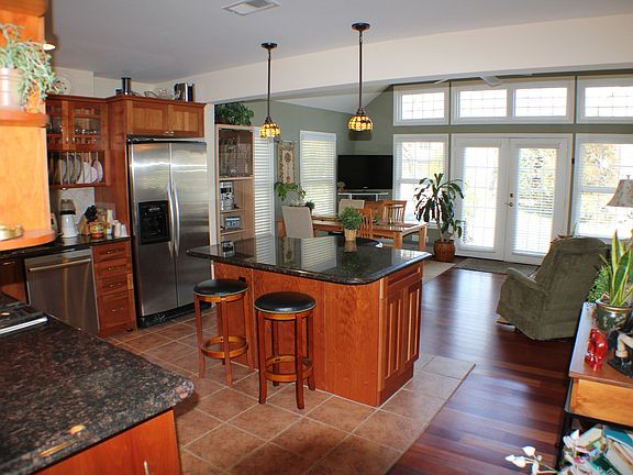 Kitchen/Family room combo with french doors leading to backyard