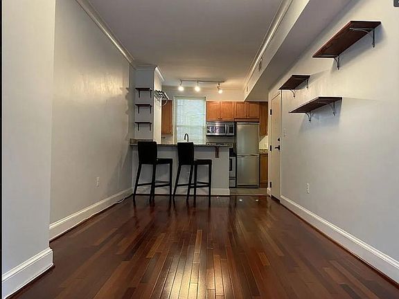 different angle of the living area and kitchen pictured in the background