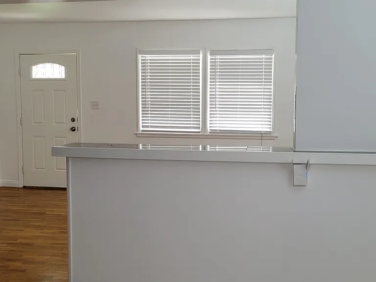 Kitchen looking to living room