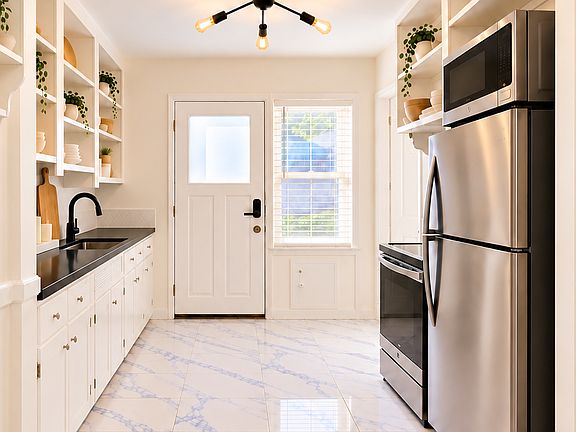 Exterior rear door access from the kitchen.
