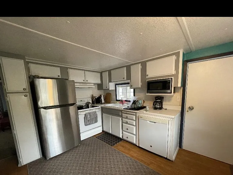 Kitchen with door to the side deck