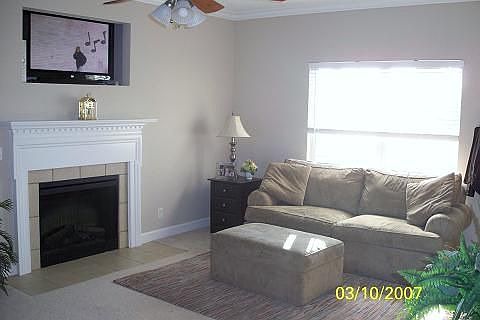 family room w/ media nook above FP.