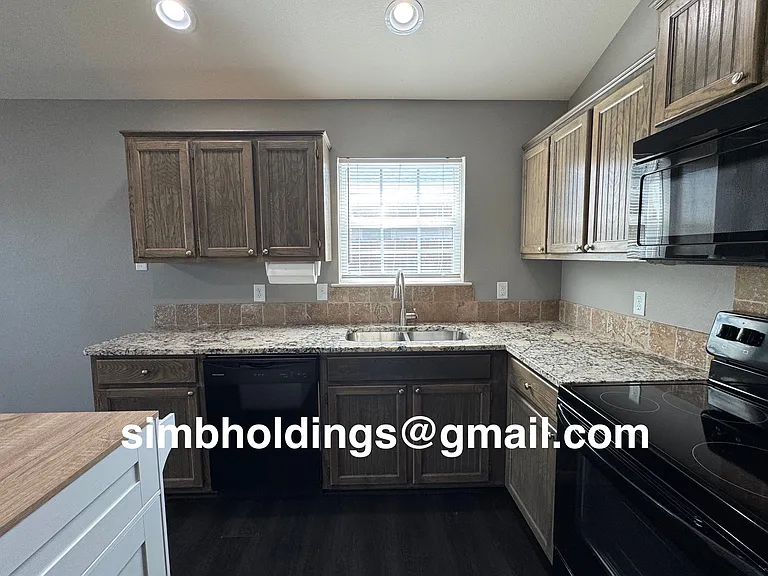 Granite counters with dishwasher and stainless steel sink