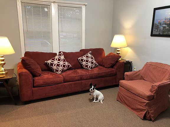 Ralph presents the living room in furnished apartment #1. Co