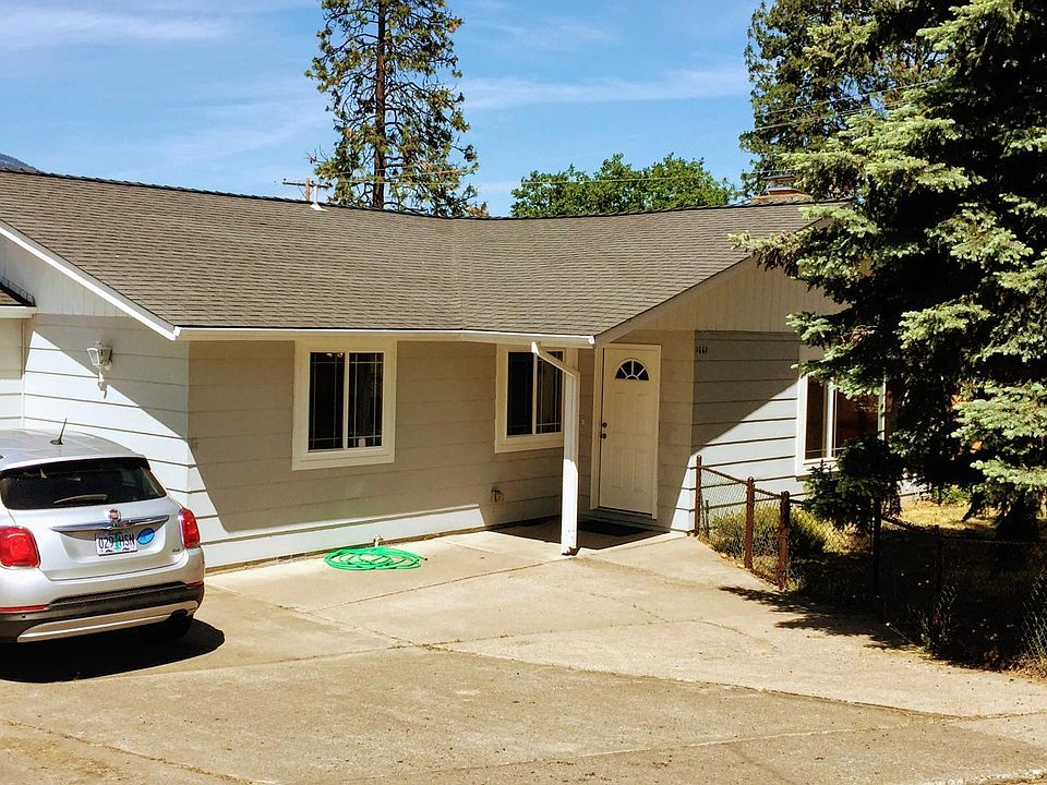 Front entry, with two car attached garage and fenced front yard