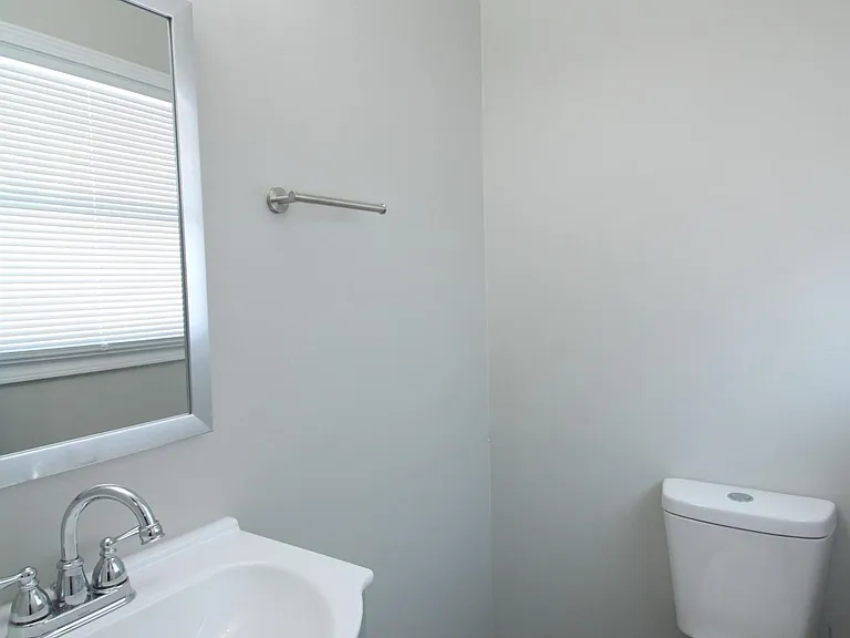 Primary en suite half bathroom