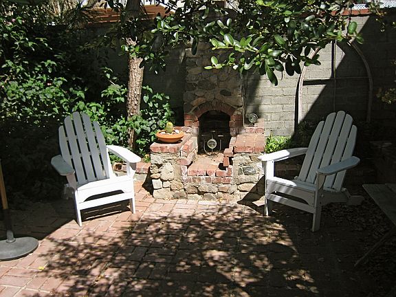 patio with outdoor fireplace