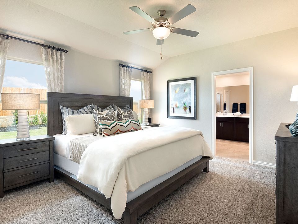 Enjoy a private primary suite tucked away in the back of the home.