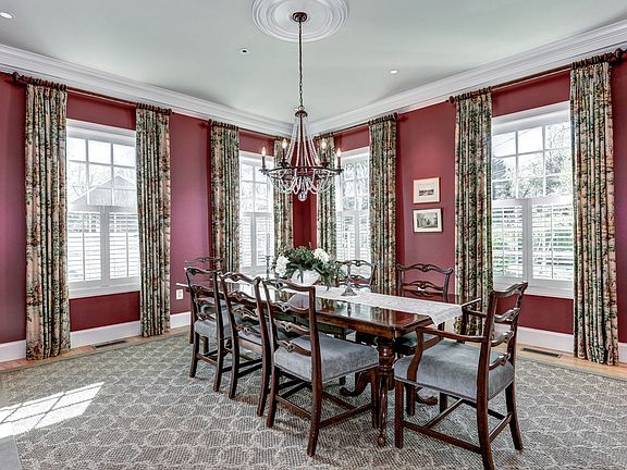 Formal Dining Room w/ elegant finishes and chandelier