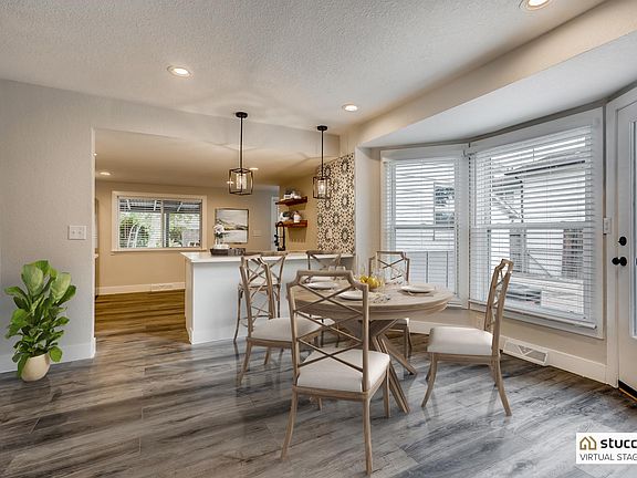 Open floor plan- room for dining room table AND bar seating