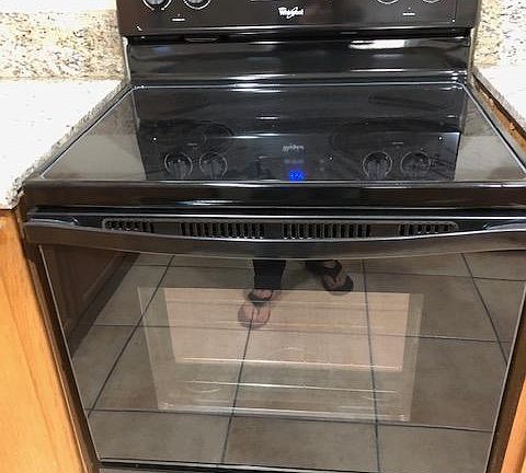 Newer electric stove and oven.