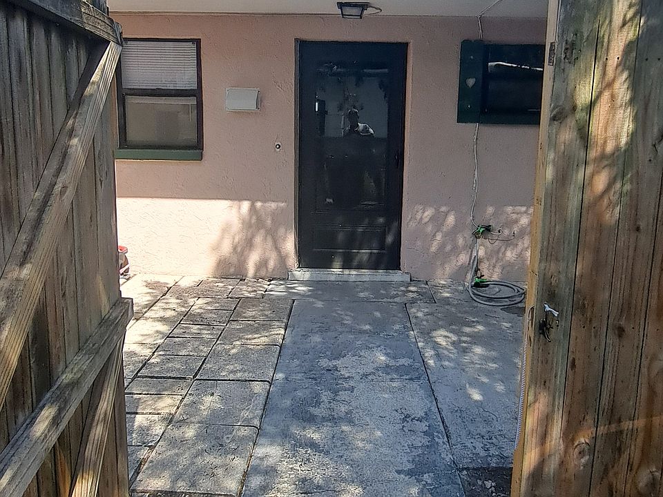 Front door and gated patio.