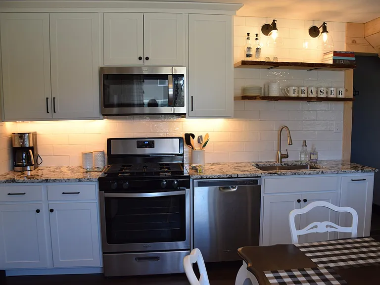 The washer/dryer and a bathroom is the door on the right.