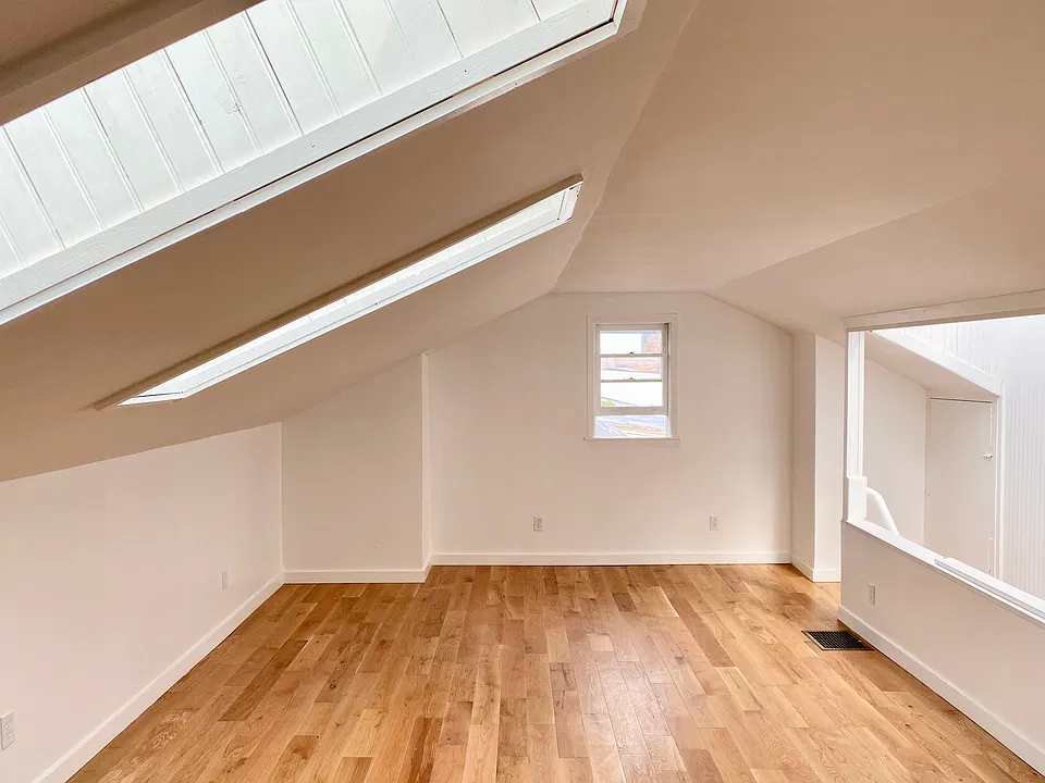 Large loft area with skylights and large closets.