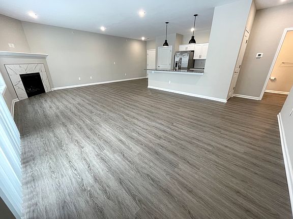 Open Concept Living Room and Kitchen with a Gas Fireplace